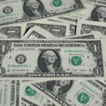 A detailed shot of a pile of U.S. one-dollar bills showcasing currency and finance concepts.
