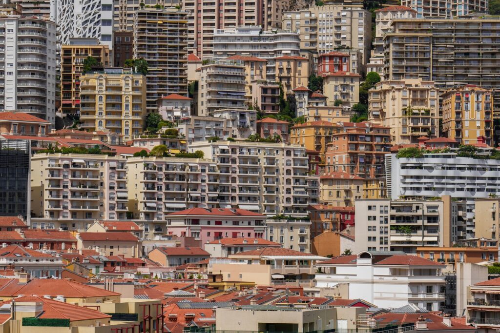 Experience the colorful and densely packed urban architecture of Monaco in this stunning cityscape photo.