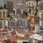Experience the colorful and densely packed urban architecture of Monaco in this stunning cityscape photo.