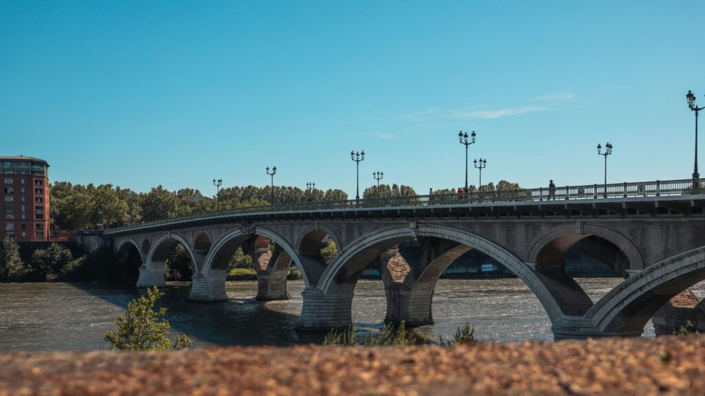 Scenic view of Pont Saint-Pierre bridge crossing the Garonne River in Toulouse, France.