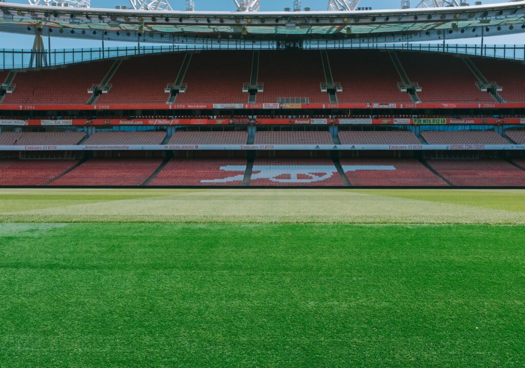 A view of the empty stands and football pitch at Emirates Stadium, London.