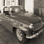 Classic Skoda Felicia parked on an urban street, captured in timeless black and white.