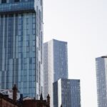 A view of modern skyscrapers in Manchester, showcasing urban architecture and city life.