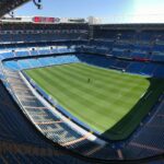 High-angle view of the empty Santiago Bernabeu Stadium on a sunny day in Madrid, Spain.