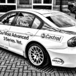 Stylish black and white photo of a high-performance race car on a city street in Burton upon Trent, UK.