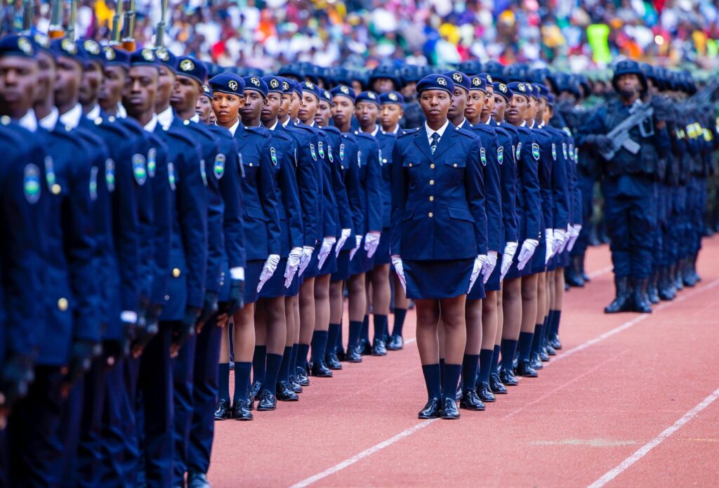 Rwandan police officers lined up in uniform formation during a ceremonial parade outdoors.