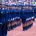 Rwandan police officers lined up in uniform formation during a ceremonial parade outdoors.