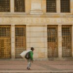 Man walking past Edificio Pedro A. Lopez in Bogotá, Colombia.