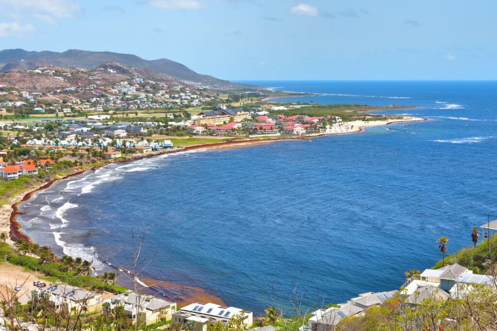 Explore the stunning coastline and turquoise waters of Frigate Bay in Saint Kitts, a perfect travel destination.