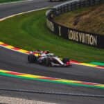 High-speed Formula 1 car racing on famous Circuit de Spa-Francorchamps in Belgium.