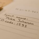 Handwritten document with agent name and ID code, showcasing personal handwritten text.