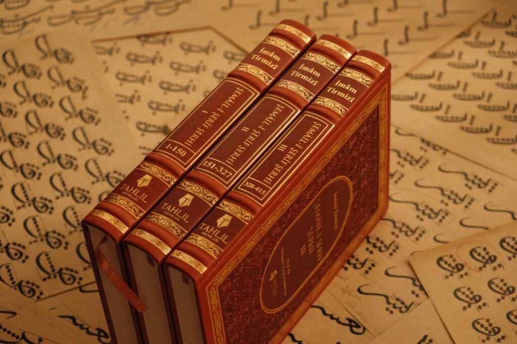 Historic Islamic books on Arabic script, showcasing cultural heritage and traditional calligraphy.