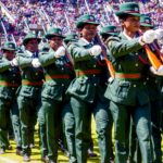 Uniformed women participating in a military parade at a stadium in Harare, Zimbabwe.