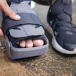 Detailed close-up of a foot in an orthopedic brace, highlighting post-injury recovery.
