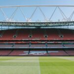 A view of the empty stands and football pitch at Emirates Stadium, London, England.