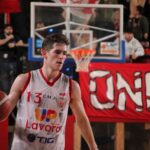 Action-packed basketball game captured in Imola, showcasing a focused player mid-game.