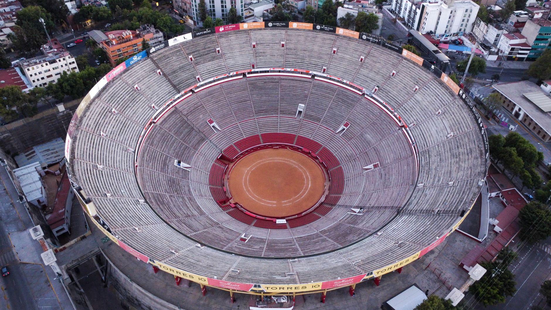 Drone shot capturing the circular bullring stadium in Mexico City from above, showcasing its architecture.
