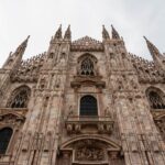 Stunning view of the intricate Gothic facade of Duomo di Milano in Italy.
