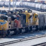 Colorful cargo train engines in Colton Rail Yard showcasing logistics and transportation.