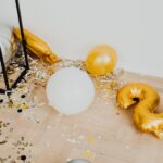 Decorative balloons and confetti on the floor, perfect for celebrations and New Year parties.