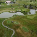 Scenic aerial image of a beautiful golf course in Auckland, New Zealand, ideal for sports and nature enthusiasts.