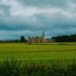 Scenic view of Duckett's Grove surrounded by lush countryside and dramatic skies in Carlow, Ireland.