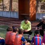 Group of kids and coaches during a youth soccer training session outdoors in İzmir, Turkey.