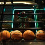 Close-up view of basketballs lined up for an arcade basketball hoop game.