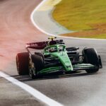 Capture of a Formula 1 car speeding on Interlagos racetrack in São Paulo, showcasing high-speed motorsport excitement.
