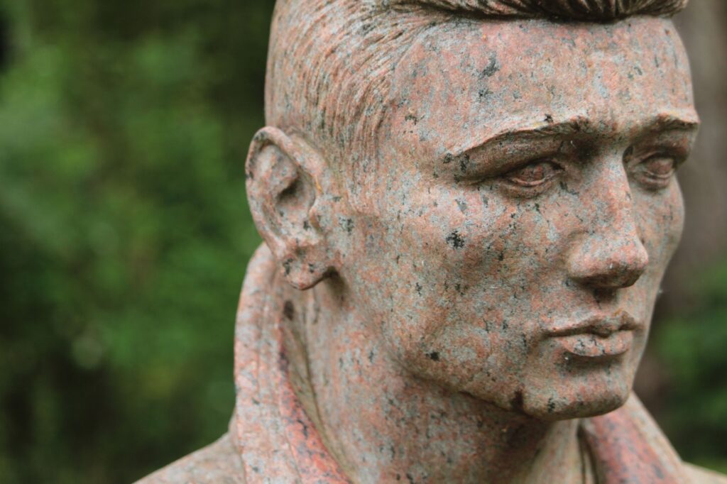 Close-up of a stone sculpture at a cemetery in Augsburg, Germany.