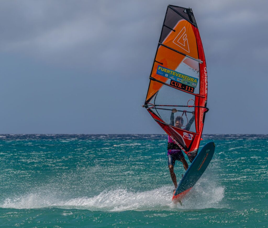 Dynamic shot of windsurfing on a bright summer day in Fuerteventura, Canary Islands.
