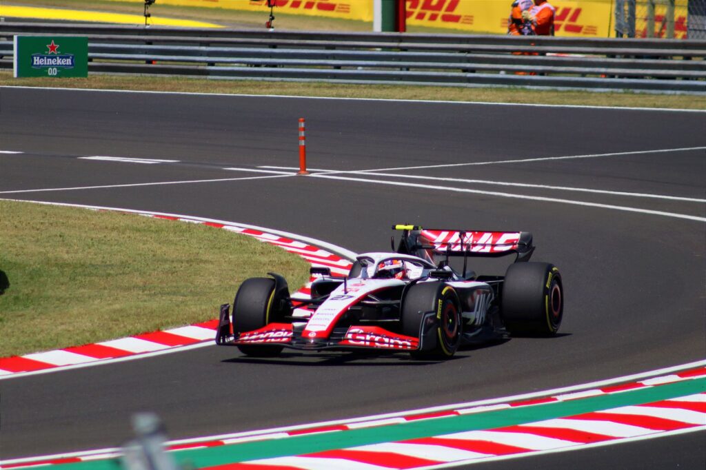 Dynamic shot of a Formula 1 car speeding around a corner at Hungaroring, Mogyoród.