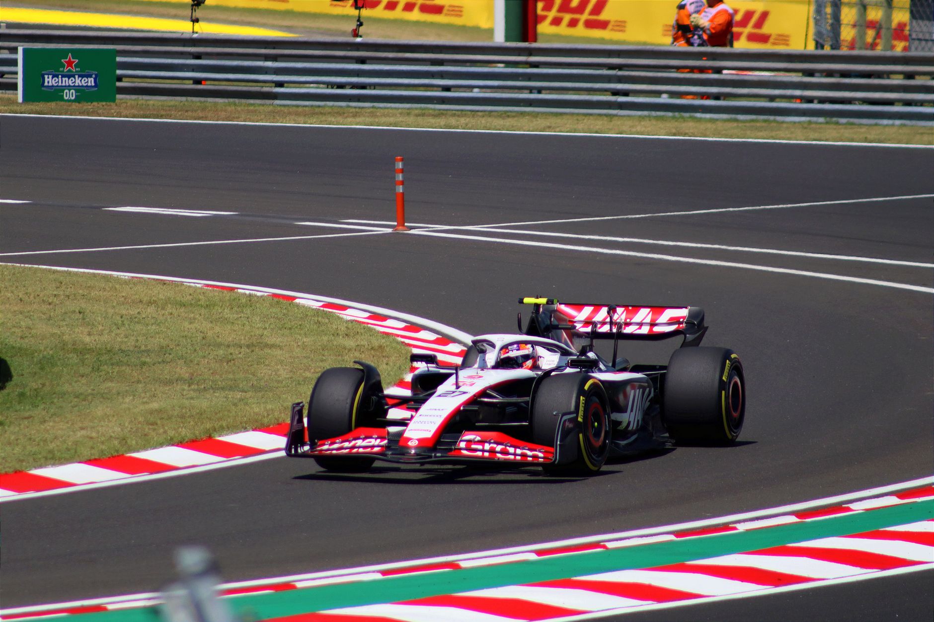 Dynamic shot of a Formula 1 car speeding around a corner at Hungaroring, Mogyoród.
