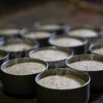 Steaming hot rice cakes in traditional bowls, capturing Indian culinary essence.