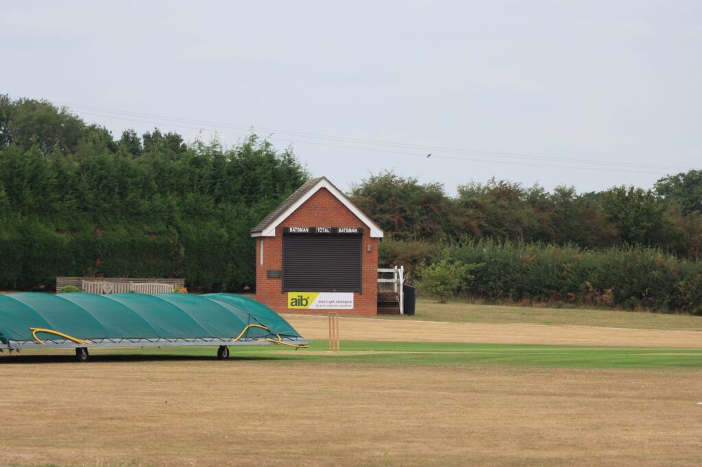 Cricket pavilion and grounds at Audley, England, showcasing a serene sports scene.
