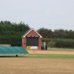 Cricket pavilion and grounds at Audley, England, showcasing a serene sports scene.