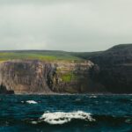 Majestic cliffs of Inishmore, County Galway, rising above turbulent waters.