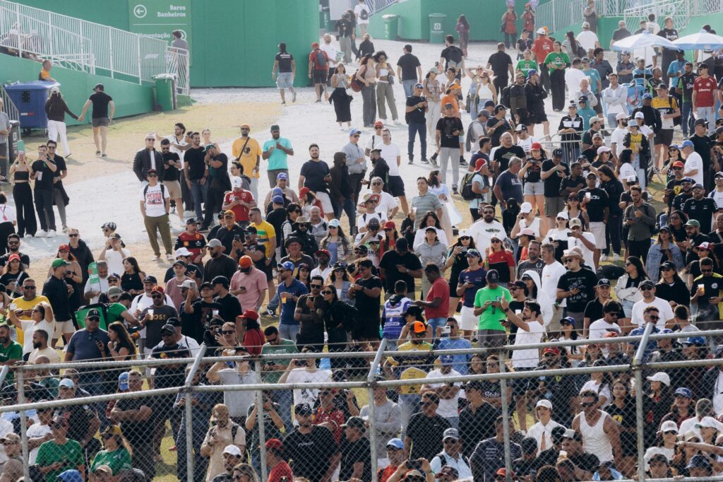 A large crowd gathers at the Interlagos Racetrack in São Paulo, Brazil during a racing event.