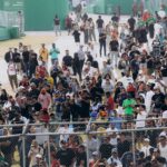 A large crowd gathers at the Interlagos Racetrack in São Paulo, Brazil during a racing event.