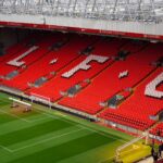 View of Anfield Stadium seating with prominent LFC letters. Perfect capture of iconic Liverpool FC venue.