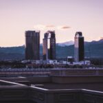 Captivating view of Las Vegas skyline against a mountain backdrop during dusk.