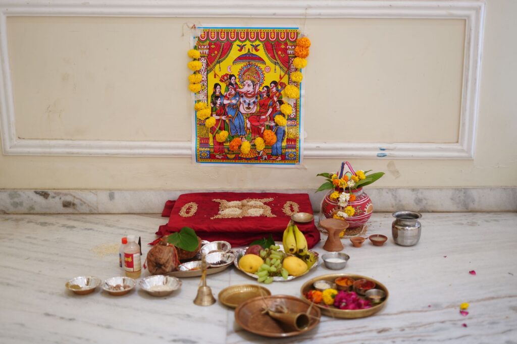 A vibrant Hindu worship setup for Ganesh Puja featuring offerings and decorative elements, symbolizing tradition and spirituality.