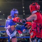 Dynamic kickboxing match capturing action and intensity between fighters in Kolkata, India.