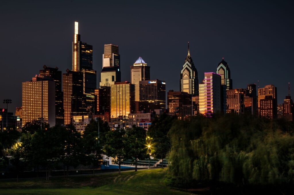 Stunning view of Philadelphia's skyline illuminated at night, showcasing iconic skyscrapers and urban beauty.