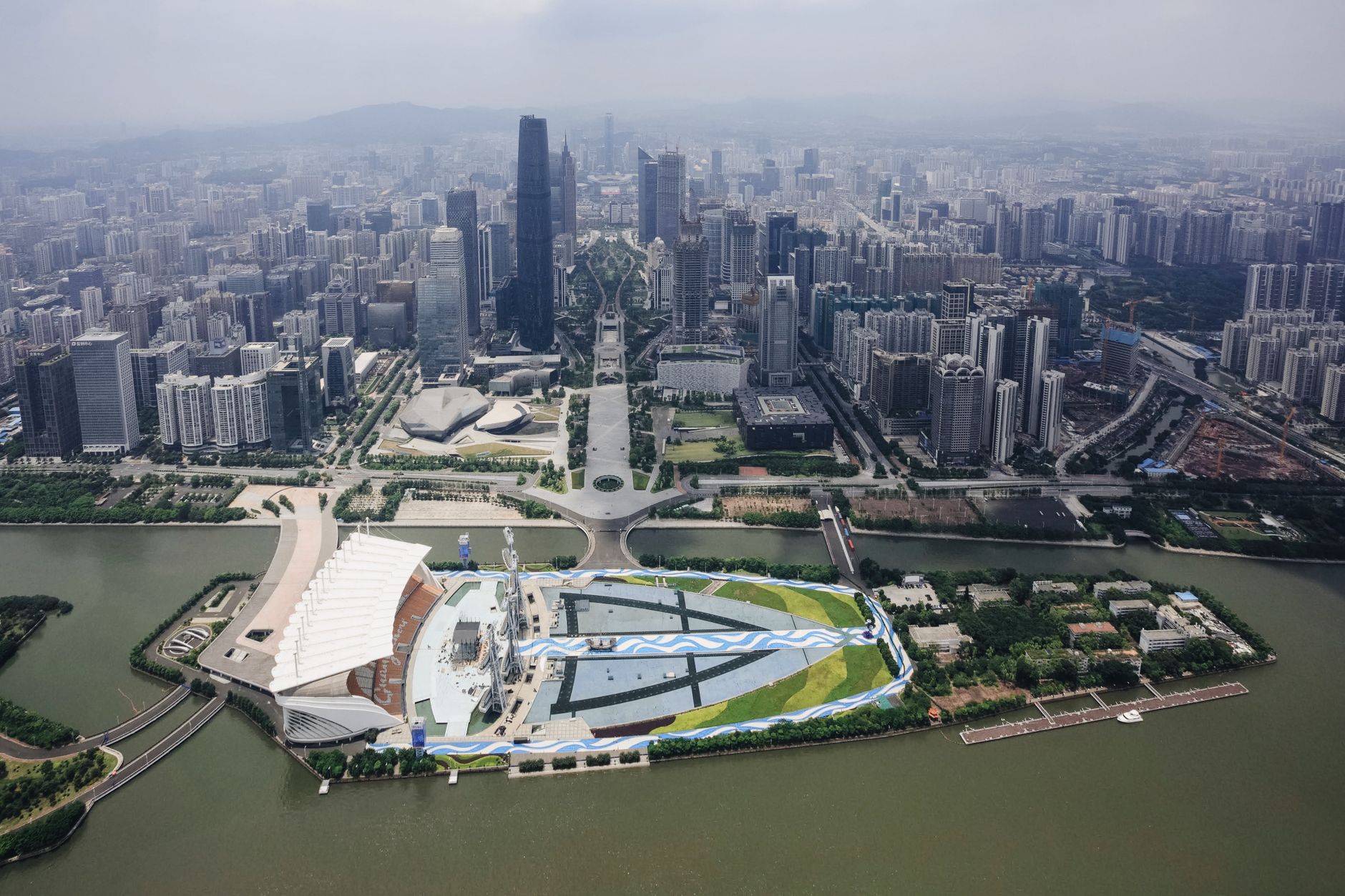 Aerial view of Guangzhou cityscape with towering skyscrapers and urban landscape.