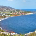 Explore the stunning coastline and turquoise waters of Frigate Bay in Saint Kitts, a perfect travel destination.