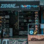 A vibrant shoe store showcasing various footwear in an urban market setting.